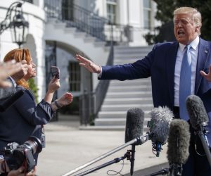 epa07895446 US President Donald J. Trump responds to a question from the news media as he walks to board Marine One on the South Lawn of the White House in Washington, DC, USA, 04 October 2019. President Trump is traveling to Walter Reed National Military Medical Center to visit wounded service members and award five Purple Heart medals.  EPA/SHAWN THEW