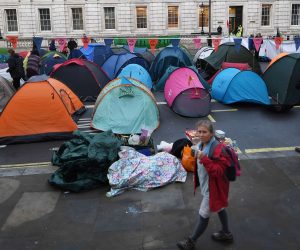 epa07905271 Tents of Extinction Rebellion climate change protesters on Whitehall in London, Britain, 08 October 2019. Extinction Rebellion civil disobendience activists announced that climate change protests and blockades will take place worldwide starting 07 October. The Extinction Rebellion (XR) climate protests movement has planned a 'spring rebellion' from 07 to 13 October 2019, including marches aimed at blocking traffic.  EPA/ANDY RAIN