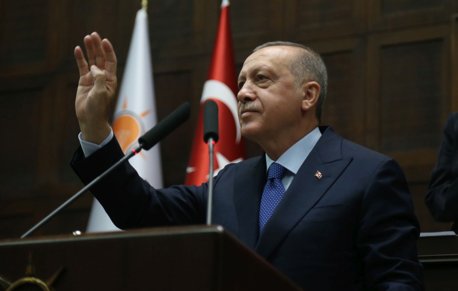 epa07924518 Turkish President Recep Tayyip Erdogan (L) greets to his supporters before he addresses members of ruling Justice and Development Party (AKP) at their group meeting at the parliament in Ankara, Turkey, 16 October 2019. Turkey on the 09 October 2019 launched a military offensive targeting Kurdish forces in north-eastern Syria, days after the US withdrew troops from the area.  EPA/STR