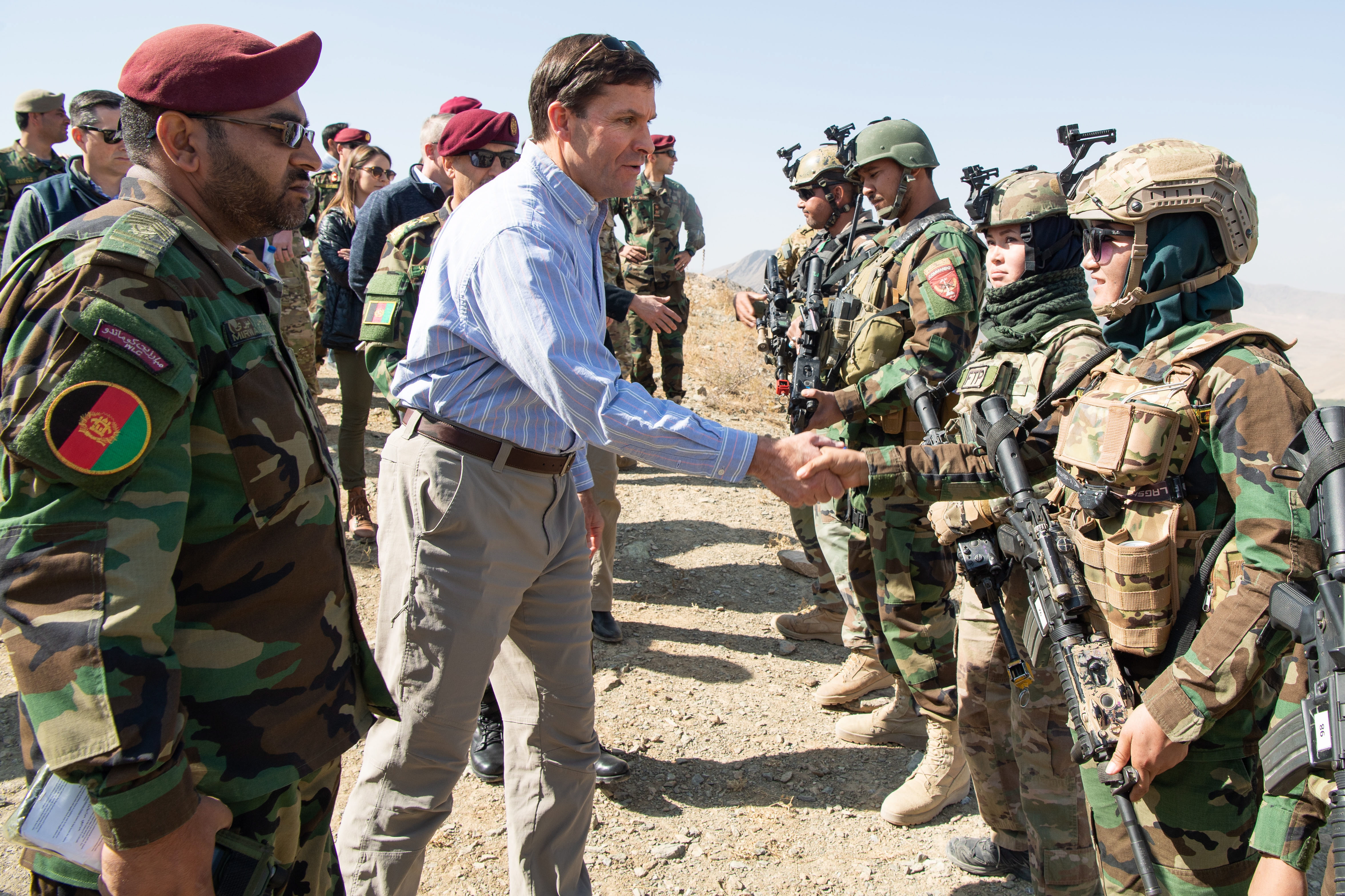 epa07940226 A handout photo made available by the US Department of Defense (DOD) shows US Defense Secretary Mark T. Esper (C) meeting with members of the Afghan special forces to observe their training at Camp Commando, Afghanistan, 21 October 2019 (issued 22 October 2019). According to reports, Defense Secretary Esper said that the reduction od US forces in Afghanistan relies on a peace agreement with the Taliban.  EPA/STAFF SGT. BRANDY NICOLE MEJIA/US DEPARTMENT OF DEFENSE HANDOUT  HANDOUT EDITORIAL USE ONLY/NO SALES