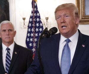 epa07943464 US President Donald J. Trump (R), with Vice President Mike Pence (L), announces the lifting of sanctions on Turkey during a statement in the Diplomatic Reception Room of the White House in Washington, DC, USA, 23 October 2019. President Trump said the US will lift the October 14th sanctions on Turkey after their offensive against the Kurds in Syria calling the cease fire permanent.  EPA/SHAWN THEW