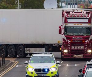 epaselect epa07943573 Police drive the lorry container along the road from the scene in Waterglade Industrial Park in Grays, Essex, Britain, 23 October 2019. A total of 39 bodies were discovered inside a lorry container in the early hours of this morning, and pronounced dead at the scene.  EPA/VICKIE FLORES