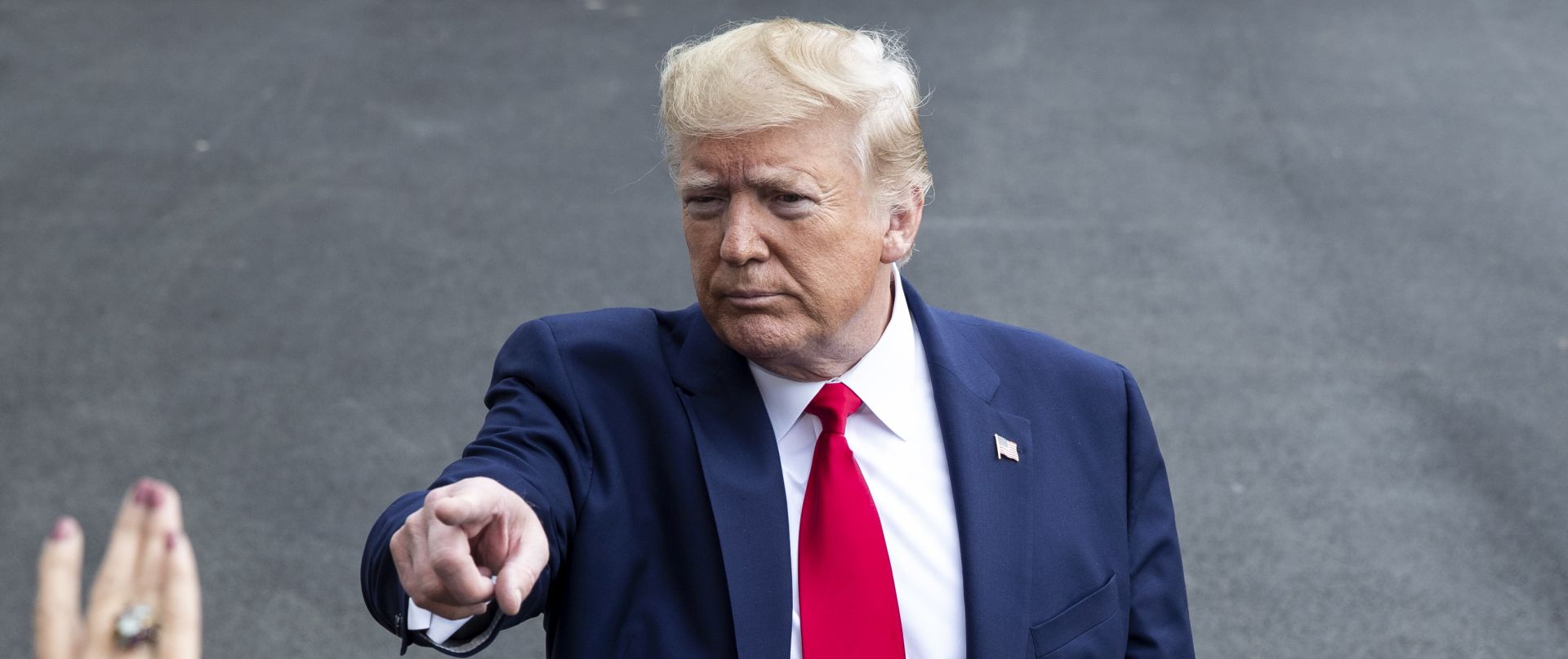 epa07949310 US President Donald J. Trump (C) takes questions from members of the news media before departing the South Lawn of the White House by Marine One, in Washington, DC, USA, 25 October 2019. Before departing for South Carolina, Trump took the opportunity to criticize the US House Democrats' impeachment probe and discussed the US military presence in Syria.  EPA/MICHAEL REYNOLDS