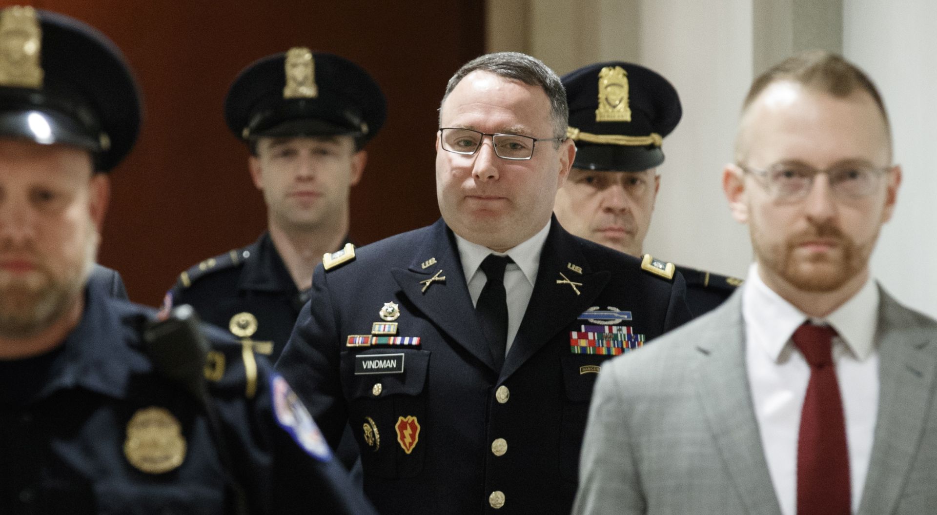 epa07957916 US Army Lieutenant Colonel Alexander Vindman (C), the top Ukraine expert on the National Security Council, arrives for a closed session before the House Intelligence, Foreign Affairs and Ov​ersight committees at the US Capitol in Washington, DC, USA, 29 October 2019. Lieutenant Colonel Vindman faces questions from the three congressional committees on a whistleblower's complaint that US President Donald J. Trump requested help from the President of Ukraine to investigate Joe Biden.  EPA/SHAWN THEW