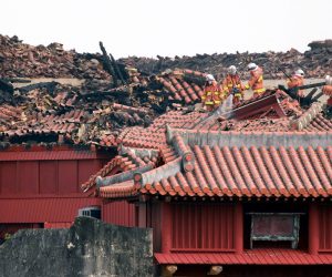 epa07961679 Firefighters inspect the heavily damaged Shuri Castle in Naha, Okinawa prefecture, Japan, 31 October 2019. On early 31 October, a fire started at Shuri Castle in Naha, a castle in Okinawa listed as a World Heritage site, destroying major buildings of the castle complex. The cause of the fire is still unknown and there is no report of injury.  EPA/HITOSHI MAESHIRO
