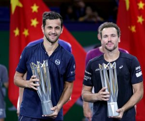 Tennis - Shanghai Masters - Men's Doubles Tennis - Shanghai Masters - Men's Doubles - Shanghai, China - October 13, 2019 - Mate Pavic of Croatia and Bruno Soares of Brazil celebrate with trophies after winning the final against Lukasz Kubot of Poland and Marcelo Melo of Brazil in the men's doubles final match. REUTERS/Aly Song ALY SONG