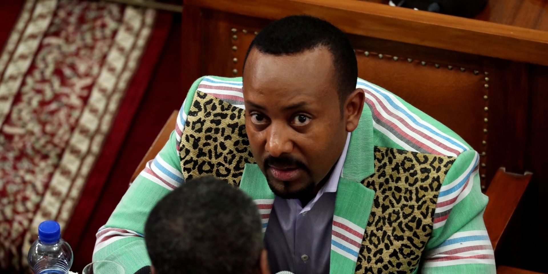 FILE PHOTO: Ethiopia's Prime Minister Abiy Ahmed talks to an unidentified legislator inside the House of Peoples' Representatives in Addis Ababa FILE PHOTO: Ethiopia's Prime Minister Abiy Ahmed talks to an unidentified legislator inside the House of Peoples' Representatives in Addis Ababa, Ethiopia October 25, 2018. REUTERS/Tiksa Negeri/File Photo Tiksa Negeri