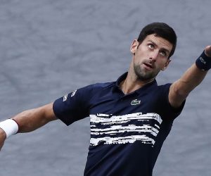 epa07966656 Novak Djokovic of Serbia serves the ball to Grigor Dimitrov of Bulgaria during their semi final match at the Rolex Paris Masters tennis tournament in Paris, France, 02 November 2019.  EPA/IAN LANGSDON