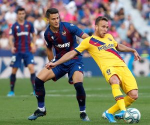 epa07967169 Levante's midfielder Nemanja Radoja (L) in action against Barcelona's midfielder Arthur Melo (R) during the Spanish LaLiga soccer match between Levante UD and FC Barcelona at Ciudad de Valencia stadium in Valencia, eastern Spain, 02 November 2019.  EPA/Miguel Angel Polo