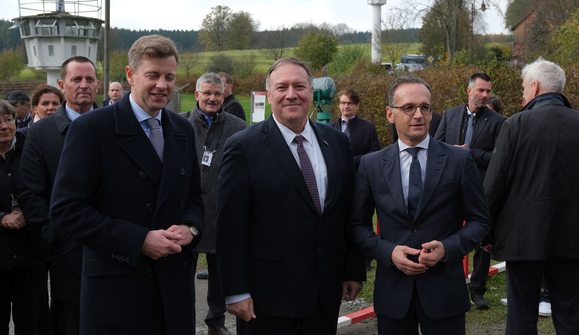 epa07978463 U.S. Secretary of State Mike Pompeo (C) and German Foreign Minister Heiko Maas (R) stand at a still-standing portion of the former fortified border between East Germany and West Germany while touring the memorial site there on November 7, 2019 in Moedlareuth, Germany. Pompeo is in Germany ahead of the November 9 30th anniversary of the fall of the Berlin Wall, which led to the collapse of the communist East German government in 1989 and the eventual reunification of East and West Germany. Pompeo served in the U.S. armed forces and was a tank commander stationed in West Germany. In Moedlareuth the border ran directly through the village.  EPA/Sean Gallup / POOL