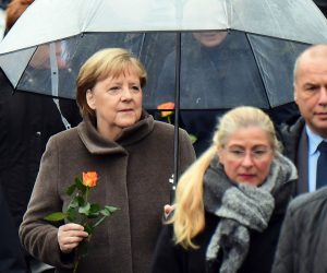 epa07982896 German Chancellor Angela Merkel (C) arrives for the celebrations of the 30th anniversary of the fall of the Berlin Wall at the Berlin Wall Memorial site along Bernauer street in Berlin, Germany, 09 November 2019. The fall of the Berlin Wall led to the collapse of the communist East German GDR government in 1989 and the eventual reunification of East and West Germany.  EPA/CLEMENS BILAN