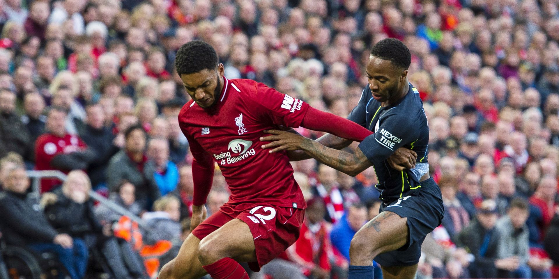 epa07990905 (FILE) - Liverpool's Joe Gomez (L) in action against Manchester City's Raheem Sterling (R) during the English Premier League soccer match between Liverpool FC and Manchester City at Anfield in Liverpool, Britain, 07 October 2018 (re-issued 12 November 2019). The England national soccer team dropped Raheem Sterling following a clash with teammate Joe Gomez at the England camp, British media reports claimed on 12 November 2019.  EPA/PETER POWELL EDITORIAL USE ONLY. No use with unauthorized audio, video, data, fixture lists, club/league logos or 'live' services. Online in-match use limited to 75 images, no video emulation. No use in betting, games or single club/league/player publications *** Local Caption *** 54684121