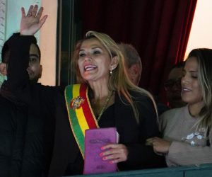 epa07992043 Opposition Senator Jeanine Anez (C) greets supporters after assuming the interim Presidency of Bolivia after the resignation and exile of former president of Evo Morales, in La Paz, Bolivia, 12 November 2019. According to media reports, Morales, the first indigenous president of this majority indigenous Andean nation, maintains that his late surge in the balloting in the 20 October elections came after votes from remote rural areas were counted. Amid pressure from violent protests Morales agreed to an audit of the votes by the Organization of American States (OAS), which found that there had been 'clear manipulation' of the vote counting process and stated a new election should be held.  EPA/STRINGER