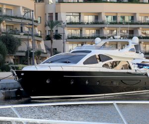 epa08011291 A Maltese police officer (L) next to the boat belonging to Dubai-registered enterprise '17 Black' owner Yorgen Fenech, berthed in Portomaso Harbour after being intercepted at sea by the Armed Forces of Malta and returned to Malta early 20 November 2019. The yacht was seized off the coast of Pembroke, limits of St. Julians soon after it had left Portomaso at 5.30am. Fenech was arrested and is in police custody, sources said, as part of investigations into the murder of Maltese journalist Daphne Caruana Galizia in 2017. Prime Minister Joseph Muscat said 19 November he had signed a letter that assures a presidential pardon to a man who claims to have information with regard to the assassination of Daphne Caruana Galizia in October 2017.  EPA/DOMENIC AQUILINA