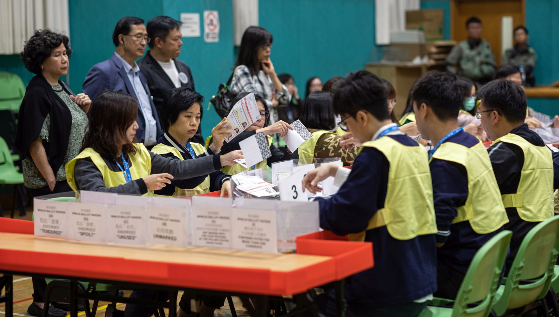 epa08022342 Staff from the Registration and Electoral Office count votes during the District Council Ordinary Election in Hong Kong, China, 24 November 2019. According to reports at least 2.8 million people voted on 24 November in the city's first election since the outbreak of widespread anti-government protests in June 2019.  EPA/JEROME FAVRE