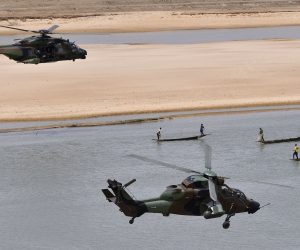 epa08025956 (FILE) - A military helicopter  carrying French President Emmanuel Macron (upper-L)  flies over Gao during a visit to France's Barkhane counter-terrorism operation in Africa's Sahel region, northern Mali, 19 May 2017 (reissued 26 November 2019). According to recent reports, 13 French soldiers died in helicopter crash during the Barkhane counter-terrorism operation against jihadists in Mali.  EPA/CHRISTOPHE PETIT TESSON / POOL