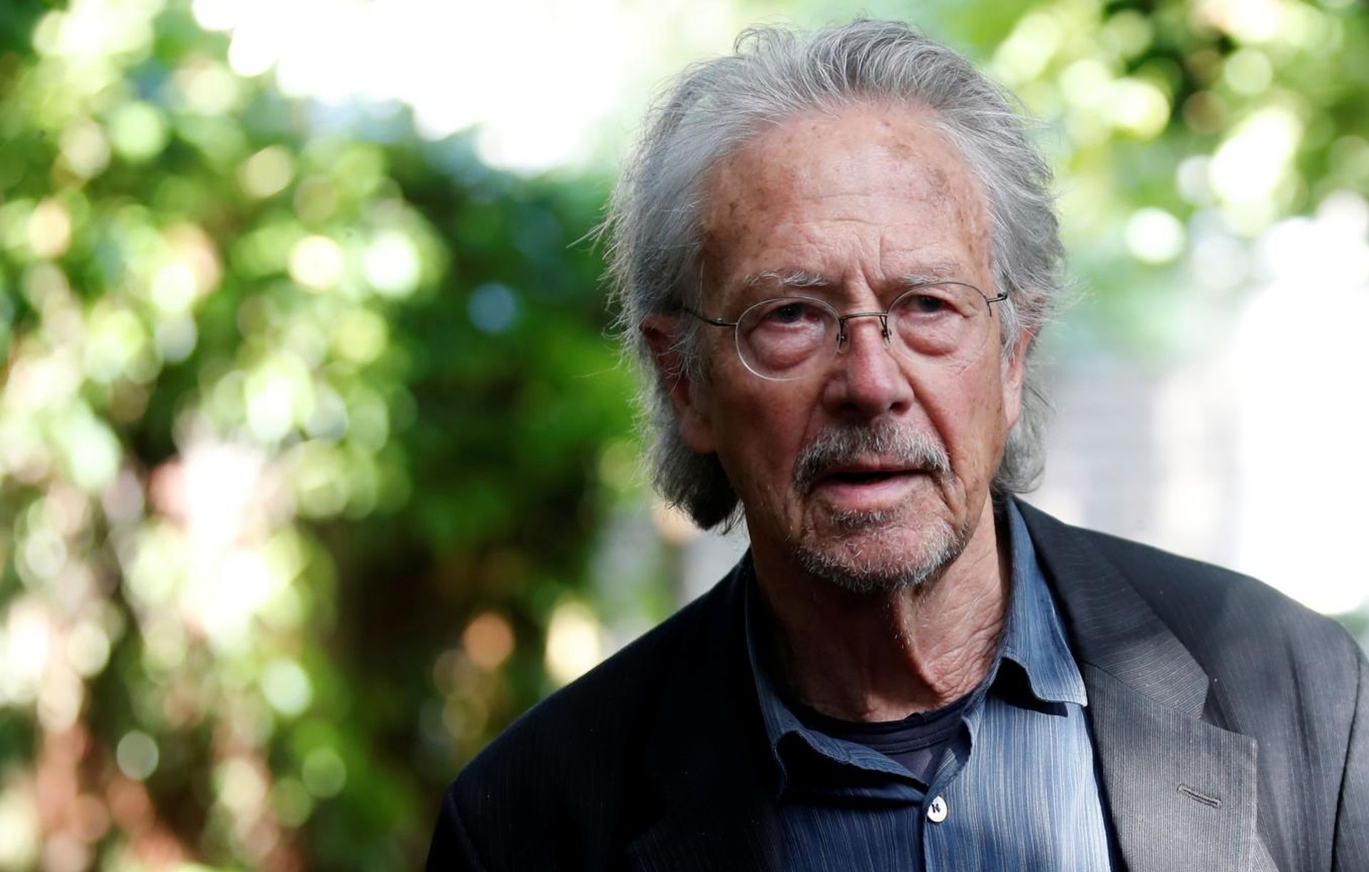 Austrian author Peter Handke, winner of the 2019 Nobel Prize in Literature, poses in his house in Chaville Austrian author Peter Handke is pictured at his house, following the announcement he won the 2019 Nobel Prize in Literature, in Chaville, near Paris, France October 10, 2019. REUTERS/Christian Hartmann CHRISTIAN HARTMANN