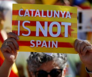 FILE PHOTO: A protester holds a poster with the slogan "Catalunya is not Spain" during a demonstration to ask for the Parliament inclusion of the 3 Catalan elected MEP's in front of the European Parliament in Strasbourg FILE PHOTO: A protester holds a poster with the slogan "Catalunya is not Spain" during a demonstration to ask for the Parliament inclusion of the 3 Catalan elected MEP's Puigdemont, Oriol Junqueras and Toni Comin, in front of the European Parliament in Strasbourg, France, July 2, 2019. REUTERS/Vincent Kessler/File Photo Vincent Kessler