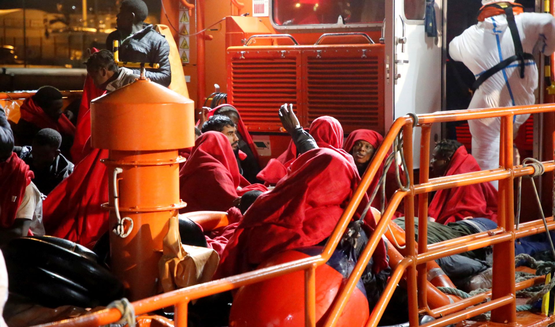 epa08028036 Around 70 migrants arrive to Melilla's Port after they were rescued on a small canoe thirty miles near Melilla's coast, Spain, 26 November 2019. Three migrants died, 10 are missing at sea and five arrived to the port seriously injured.  EPA/FG Guerrero