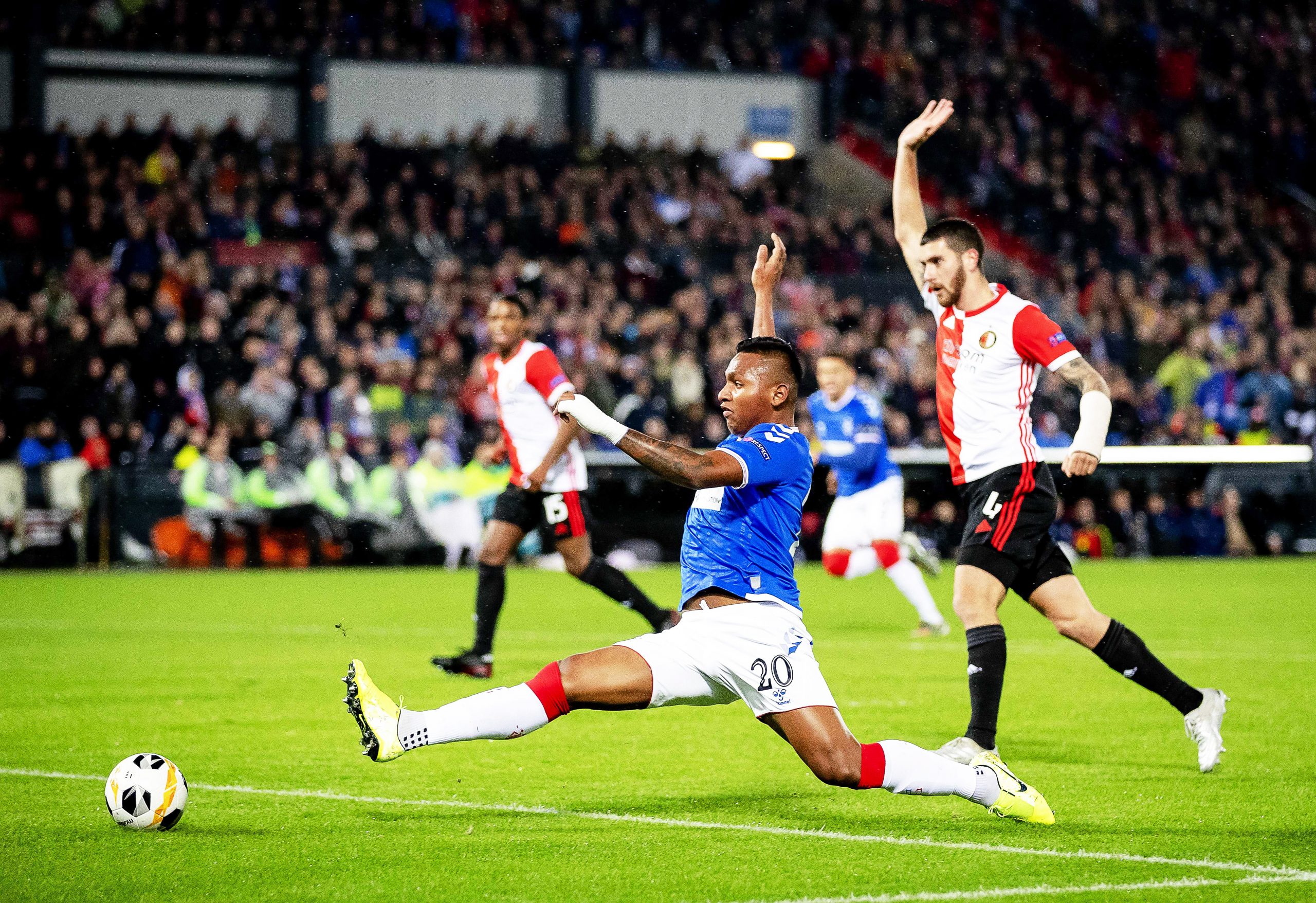 epa08031759 Marcos Senesi (R) of Feyenoord in action against Alfredo Morelos (L) of Rangers during the UEFA Europa League group stage soccer match between Feyenoord Rotterdam and Glasgow Rangers in Rotterdam, Netherlands, 28 November 2019.  EPA/ROBIN VAN LONKHUIJSEN
