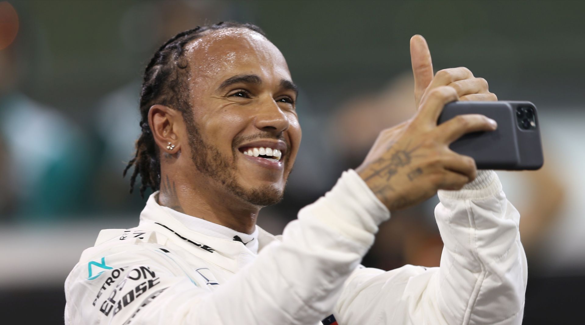 epa08035016 British Formula One driver Lewis Hamilton of Mercedes AMG GP reacts as he took pole position in the qualifying session of Abu Dhabi Formula 1 Grand Prix 2019 in Abu Dhabi, United Arab Emirates, 30 November 2019. The Formula One Grand Prix of Abu Dhabi will take place on 01 December 2019.  EPA/ALI HAIDER