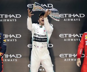 epa08037338 (L-R) Second placed Dutch Formula One driver Max Verstappen of Aston Martin Red Bull Racing, winner British Formula One driver Lewis Hamilton of Mercedes AMG GP and third placed Monaco's Formula One driver Charles Leclerc of Scuderia Ferrari on the podium after the Abu Dhabi Formula 1 Grand Prix 2019 in Abu Dhabi, United Arab Emirates, 01 December 2019.  EPA/ALI HAIDER
