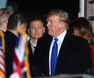 epa08040460 US President Donald J. Trump disembarks from Air Force One upon arrival for a NATO Summit, at Stansted Airport in London, Britain, 02 December 2019. NATO countries' heads of states and governments gather in London for a two-day meeting.  EPA/ANDY RAIN *** Local Caption *** 54486492
