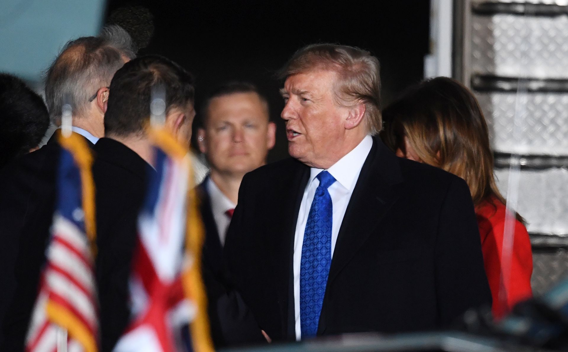 epa08040460 US President Donald J. Trump disembarks from Air Force One upon arrival for a NATO Summit, at Stansted Airport in London, Britain, 02 December 2019. NATO countries' heads of states and governments gather in London for a two-day meeting.  EPA/ANDY RAIN *** Local Caption *** 54486492