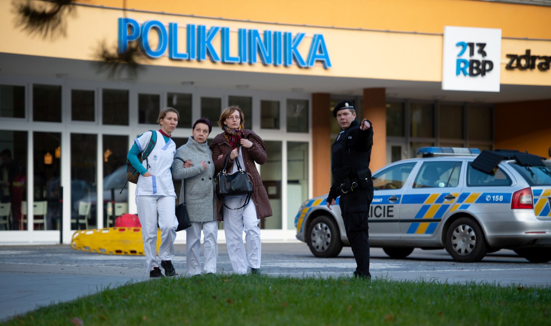 epa08058995 People are evacuated from a hospital after a shooting incident, in Ostrava, Czech Republic, 10 December 2019. According to police, at least six people have been killed in a shooting at a hospital in Ostrava. The police is looking for a suspected gunman who is at large, media reported.  EPA/LUKAS KABON