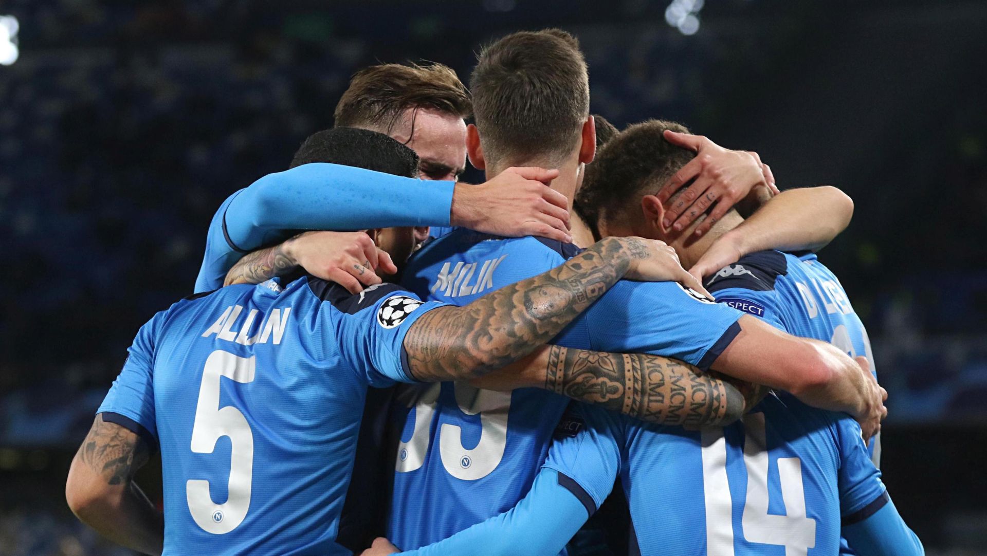 epa08060783 Napoli players celebrate during the UEFA Champions League Group E soccer match between SSC Napoli and KRC Genk at the San Paolo stadium in Naples, Italy, 10 December  2019.  EPA/CESARE ABBATE