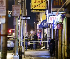 epa08061520 Police secure and investigate the scene of a multiple shooting in Jersey City, New Jersey, USA, 10 December 2019. Six people were killed, including the two shooters and a police officer, earlier on the same day when two men shot a police officer in an area cemetery and then had a shootout with police from inside a kosher supermarket.  EPA/JUSTIN LANE