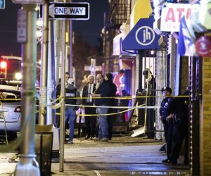 epa08061520 Police secure and investigate the scene of a multiple shooting in Jersey City, New Jersey, USA, 10 December 2019. Six people were killed, including the two shooters and a police officer, earlier on the same day when two men shot a police officer in an area cemetery and then had a shootout with police from inside a kosher supermarket.  EPA/JUSTIN LANE