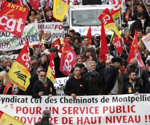 epa08065696 Members of the 'Confederation Generale du Travail' (CGT) trade union participate in a demonstration against pension reforms in Montpellier, France, 12 December 2019. Unions representing railway and transport workers and many others in the public sector have called for a general strike and demonstration to protest against French government's reform of the pension system.  EPA/GUILLAUME HORCAJUELO