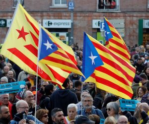 epa08079531 People attend a protest called for by the pro-Catalan independence initiative 'Tsunami Democratic' near the Camp Nou stadium in Barcelona, Spain, 18 December 2019, ahead of a Spanish LaLiga soccer match between FC Barcelona and Real Madrid at the Camp Nou stadium. Barcelona will face Real Madrid in their Spanish LaLiga soccer match, initially scheduled for 26 October 2019.  EPA/TONI ALBIR