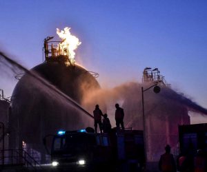 epa08084623 A handout photo made available by the official Syrian Arab News Agency (SANA) shows firefighters extinguishing a fire at the Homs refinery, Homs governorate, Syria, 21 December 2019. According to SANA, the Homs refinery, Gas factory of southern Central region and al-Rayan Gas station came under 'terrorist synchronous attacks' causing damage in the production units.  EPA/SANA HANDOUT  HANDOUT EDITORIAL USE ONLY/NO SALES