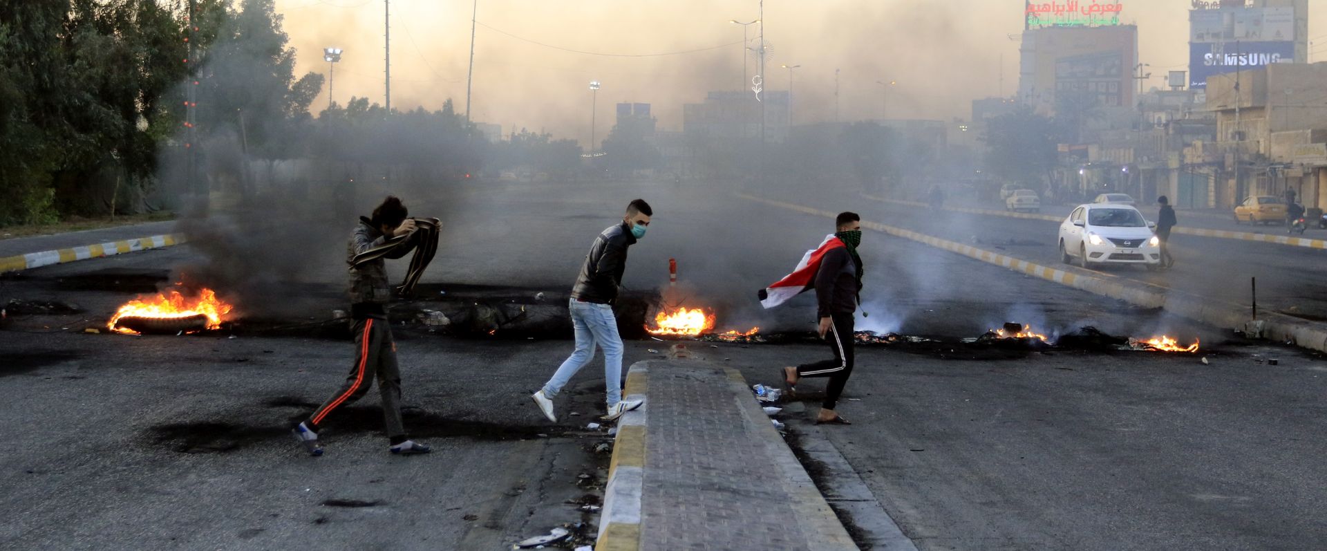 epaselect epa08089240 Demonstrators burn tires to close a way in central Karbala city, southern Iraq, 24 December 2019. Al Binaa coalition (Construction coalition), one of Iraq's biggest coalitions, announced it had officially proposed Qusay al-Suhail for the post of Prime Minister to President Barham Salih, while Hundreds of thousands of Protesters took to the streets in Iraq's capital and across the southern cities and chanted slogans rejecting the candidacy of Qusay al-Suhail for the post of prime minister.  EPA/FURQAN AL-AARAJI