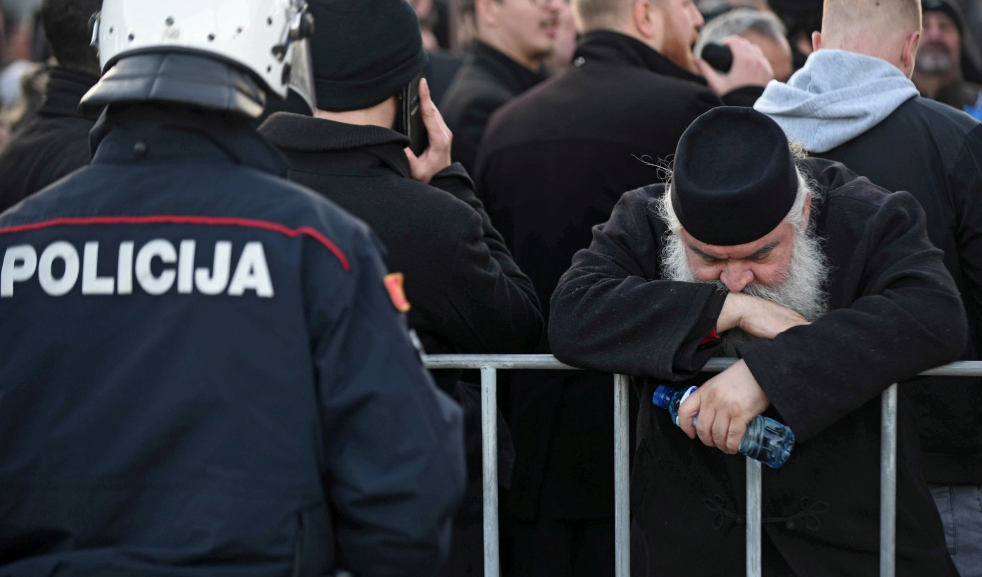 epa08090972 Serbian Orthodox Church in Montenegro monk takes part in a protest rally in Podgorica, Montenegro, 26 December 2019. Members of the Serbian Orthodox Church in Montenegro are protesting against a controversial new law on religion, which the church has called a plot to strip it of its property. Montenegro's government proposed a new bill on religion requiring all religious communities, including Catholic and Orthodox churches, to register their immovable assets as state property. The law also states that religious communities can only retain their assets if they can produce evidence of the right to ownership, triggering allegations from the Serbian Church that the government plans to dispute its holdings.  EPA/BORIS PEJOVIC  EPA-EFE/BORIS PEJOVIC