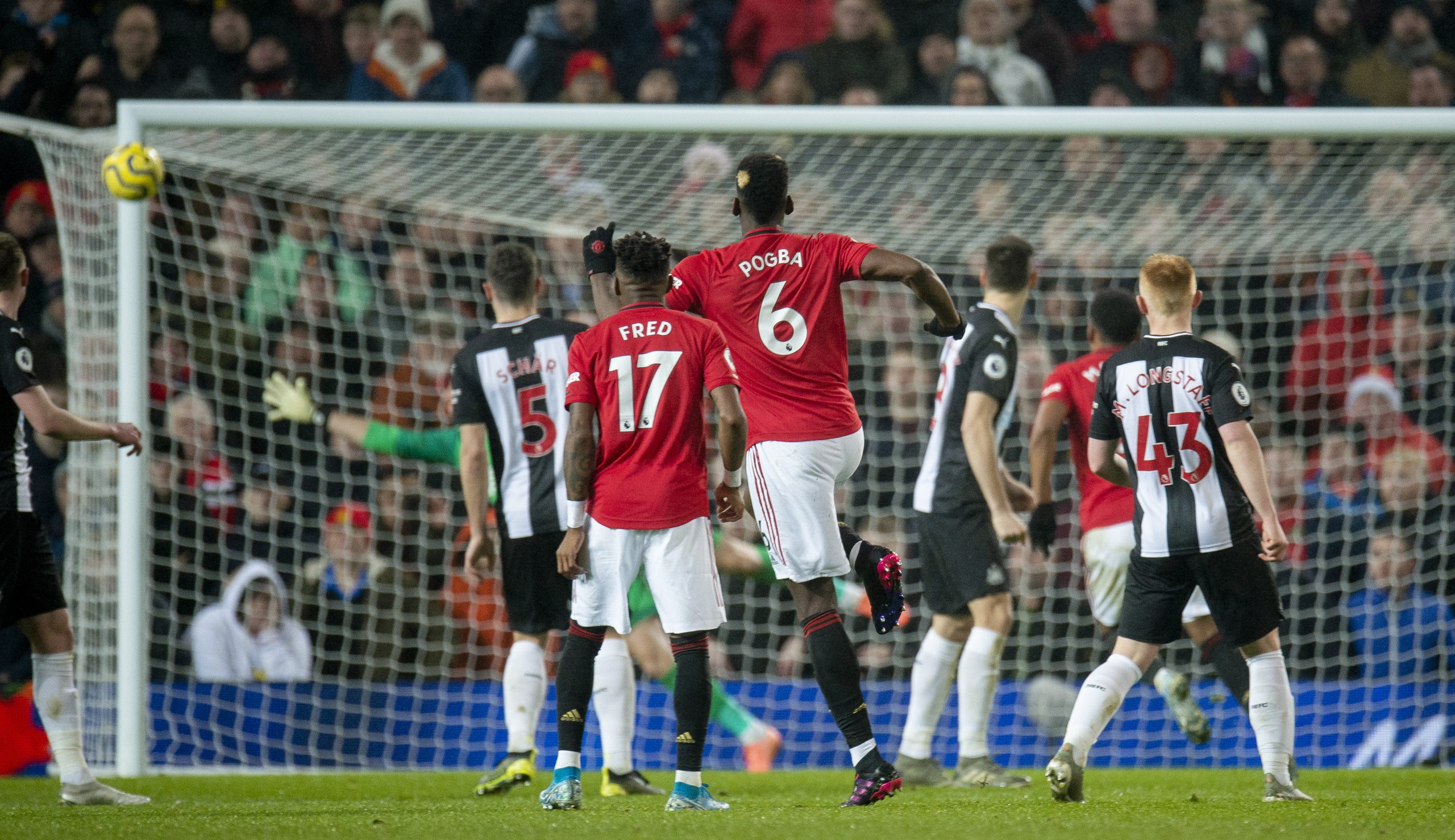 epa08091176 Manchester United's Paul Pogba (C) in action during the English Premier League soccer match between Manchester United and Newcastle United at Old Trafford, Manchester, Britain, 26 December 2019.  EPA/PETER POWELL EDITORIAL USE ONLY. No use with unauthorized audio, video, data, fixture lists, club/league logos or 'live' services. Online in-match use limited to 120 images, no video emulation. No use in betting, games or single club/league/player publications