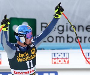 epa08092036 Dominik Paris of Italy celebrates in the finish area after winning the Men's Downhill at the FIS Alpine Skiing World Cup in Bormio, Italy,27 December 2019.  EPA/FELICE CALABRO