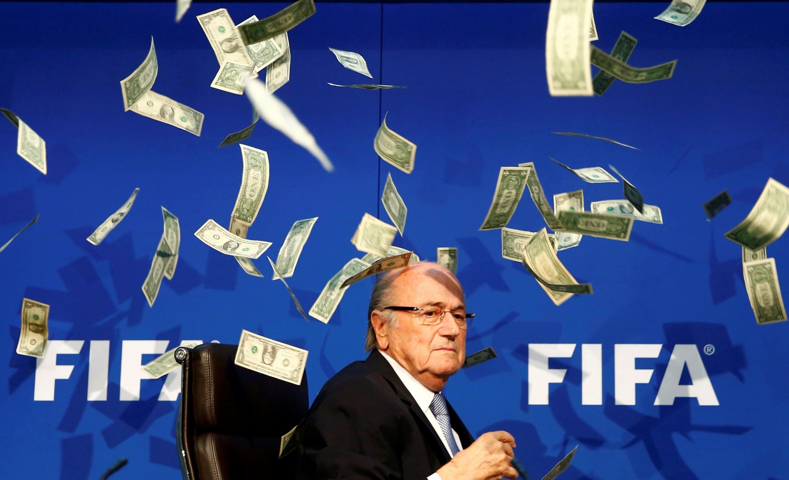 Pictures of the Decade British comedian known as Lee Nelson (unseen) throws banknotes at FIFA President Sepp Blatter as he arrives for a news conference after the Extraordinary FIFA Executive Committee Meeting at the FIFA headquarters in Zurich, Switzerland, July 20, 2015. Picture taken July 20, 2015. REUTERS/Arnd Wiegmann/File Photo   SEARCH "POY DECADE" FOR THIS STORY. SEARCH "REUTERS POY" FOR ALL BEST OF 2019 PACKAGES. TPX IMAGES OF THE DAY. ARND WIEGMANN