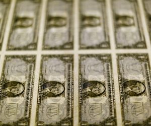 FILE PHOTO: United States one dollar bills seen on a light table at the Bureau of Engraving and Printing in Washington FILE PHOTO: United States one dollar bills are seen on a light table at the Bureau of Engraving and Printing in Washington November 14, 2014. REUTERS/Gary Cameron/File Photo Gary Cameron