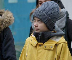 epa08068577 Swedish environmental activist Greta Thunberg walks at Piazza Castello, Turin, Italy, 13 December 2019. Thunbeg will attend the 'March for Climate', demanding action against climate change later in the day.  EPA/Tino Romano