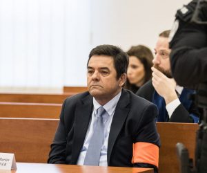 epa08081169 Marian Kocner (C) looks on at the begging of a preliminary hearing of an indictment before the main trial concerning the murder of journalist Jan Kuciak and his fiance Martina Kusnirova in the Judicial Academy building in Pezinok, Slovakia, 19 December 2019. The prosecutor of the Special Prosecutor’s Office filed criminal charges against Marian Kocner, Tomas Szabo, Miroslav Marcek and Alena Zsuzsova on 21 October 2019. The indictment concerns six crimes, including two first-degree murders.  EPA/JAKUB GAVLAK