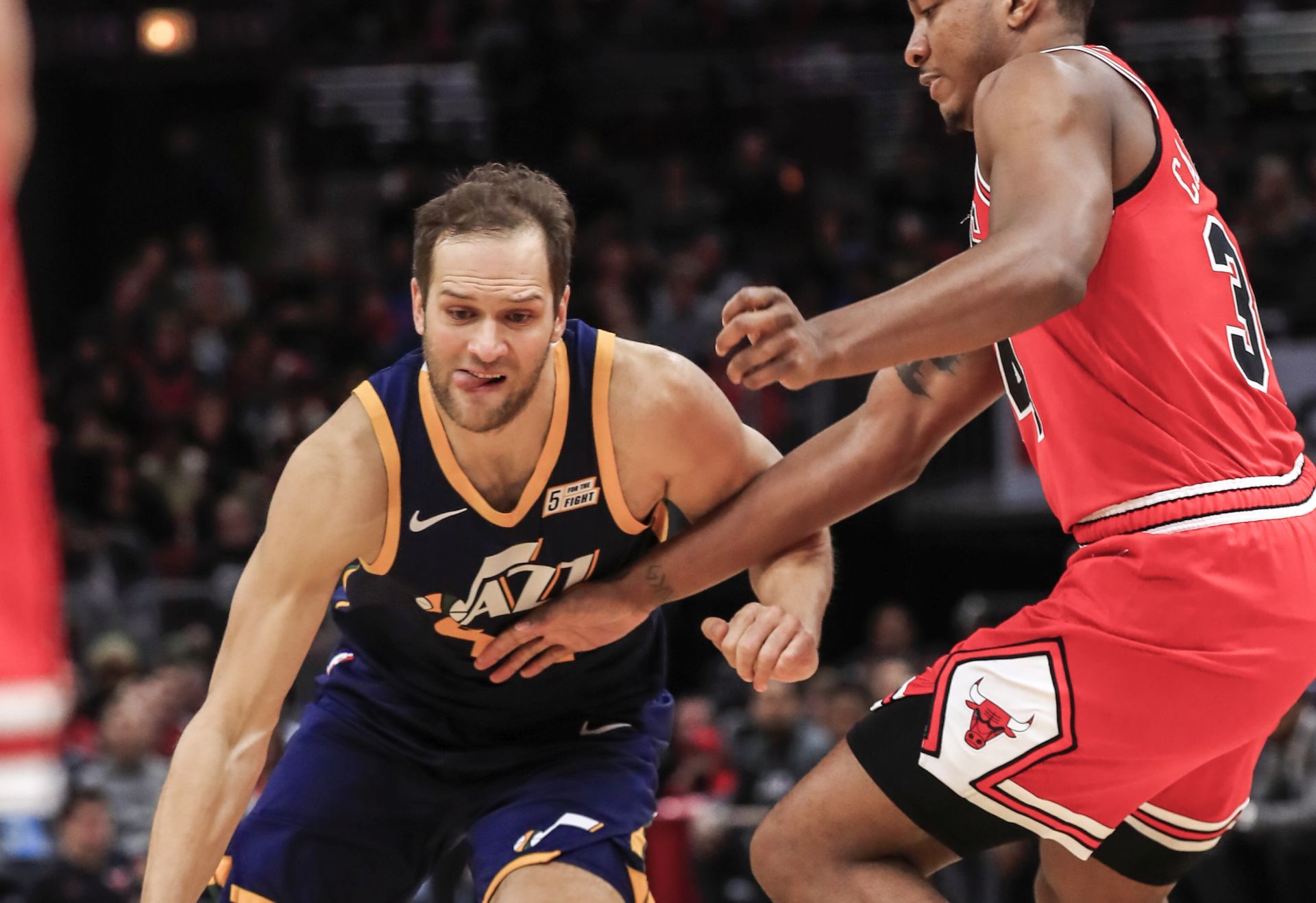 epa08099157 Utah Jazz forward Bojan Bogdanovic of Croatia (L) drives on Chicago Bulls center Wendell Carter Jr. (R) during the NBA game between the Utah Jazz and the Chicago Bulls at the United Center in Chicago, Illinois, USA, 02 January 2020.  EPA/TANNEN MAURY SHUTTERSTOCK OUT