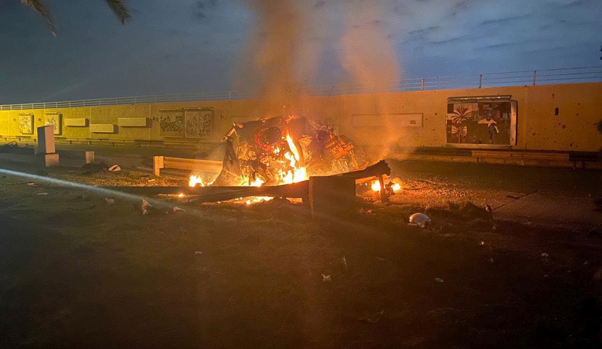 epa08099403 A handout photo made available by Iraq's military-run Security Media Cell via facebook shows a burning vehicle near Baghdad International Airport, Iraq, 03 January 2020. According to Iraqi authorities, several people were injusre in the incident, which was reportedly caused by three rockets hitting the airport. The Pentagon announced that Iran's Quds Force leader Qasem Soleimani and Iraqi militia commander Abu Mahdi al-Muhandis were killed on 03 January 2020 following a US airstrike at Baghdad's international airport.  EPA/IRAQ'S SECURITY MEDIA CELL HANDOUT -- BEST QUALITY AVAILABLE -- HANDOUT EDITORIAL USE ONLY/NO SALES
