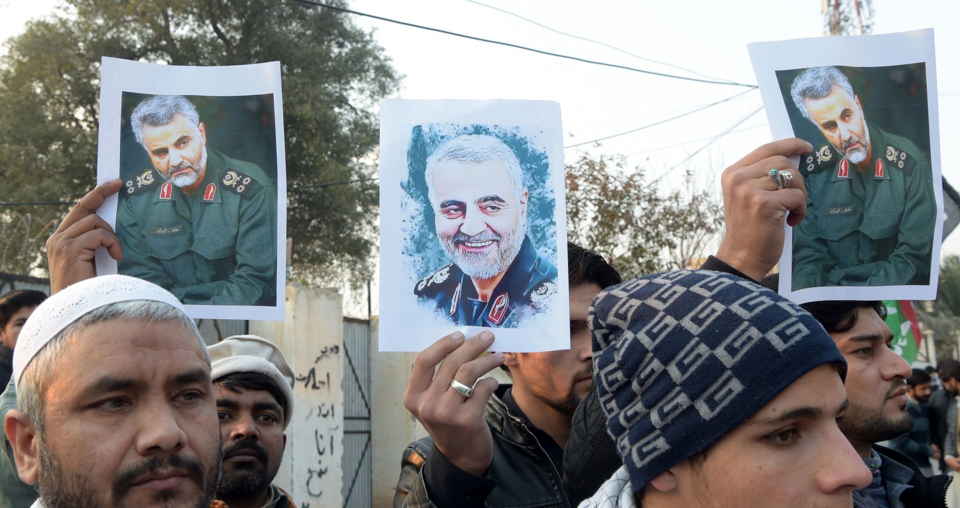 epa08100299 Pakistani Shi'ite Muslims hold pictures of General Qasem Soleimani, the head of Iran's Islamic Revolutionary Guard Corps' elite Quds Force, during a protest against the USA, in Peshawar, Pakistan, 03 January 2020. General Qasem Soleimani, was killed in an airstrike on 03 January, in Baghdad ordered by the United States president, the Pentagon said. General Soleimani was in charge of Iran's foreign policy strategy as the head of the Quds Force, an elite wing of the Islamic Revolutionary Guard Corps, which the US designated as a terror organization. The Quds Force holds sway over a raft of Shia militias across the region, from Lebanon to Syria and Iraq.  EPA/SOHAIL SHAHZAD
