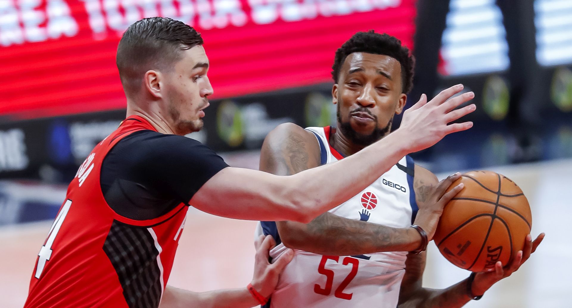 epa08100906 Washington Wizards guard Jordan McRae (R) in action against Portland Trail Blazers forward Mario Hezonja (L) of Croatia during the first half of the NBA basketball game between the Portland Trail Blazers and the Washington Wizards at Capital One Arena in Washington, DC, USA, 03 January 2020.  EPA/ERIK S. LESSER  SHUTTERSTOCK OUT