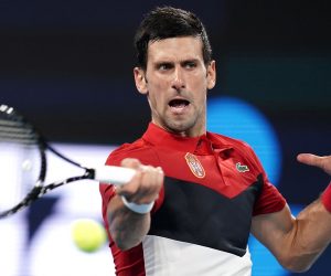 epa08101867 Novak Djokovic of Serbia in action during his singles match against Kevin Anderson of South Africa on day 2 of the ATP Cup tennis tournament at Pat Rafter Arena in Brisbane, Australia, 04 January 2020.  EPA/DAVE HUNT  AUSTRALIA AND NEW ZEALAND OUT  EDITORIAL USE ONLY