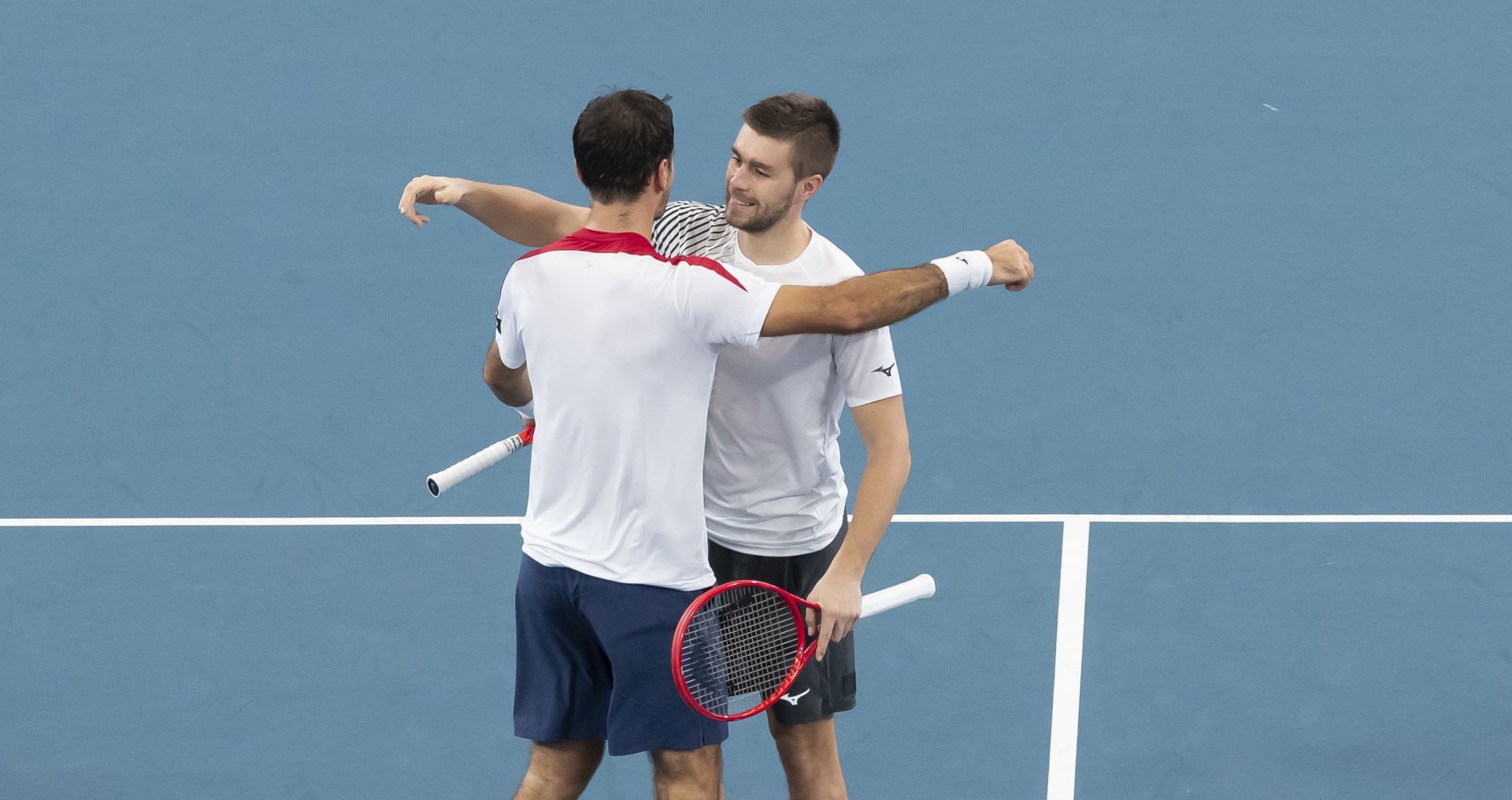 epa08106680 Ivan Dodig (L) and Nikola Mektic (R) of Croatia react after winning against Poland during the doubles match on day four of the ATP Cup tennis tournament at Ken Rosewall Arena in Sydney, Australia, 06 January 2020.  EPA/CRAIG GOLDING AUSTRALIA AND NEW ZEALAND OUT  EDITORIAL USE ONLY