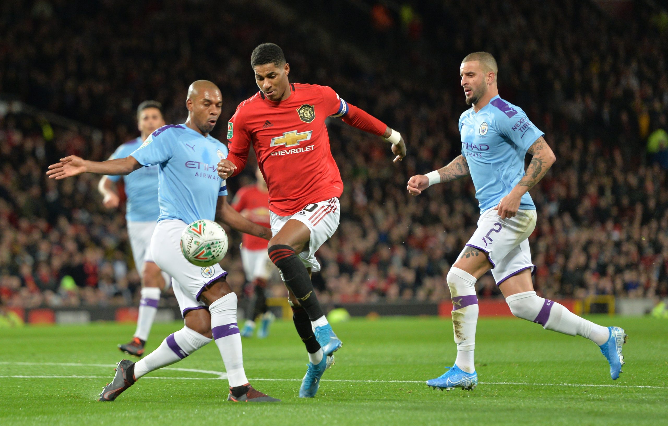 epa08110963 Manchester City's  Fernandinho (L) in action against Manchester United's Marcus Rashford (C) during the Carabao Cup first round semi-final soccer match between Manchester United and Manchester City held at Old Trafford in Manchester, Britain, 07 January 2020.  EPA/PETER POWELL EDITORIAL USE ONLY.  No use with unauthorized audio, video, data, fixture lists, club/league logos or 'live' services. Online in-match use limited to 120 images, no video emulation. No use in betting, games or single club/league/player publications.